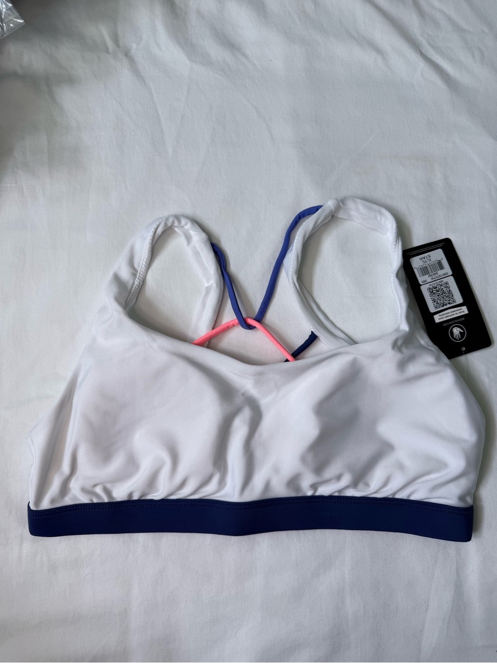 Women’s White Sports Bra with Navy Band and Pink Accent